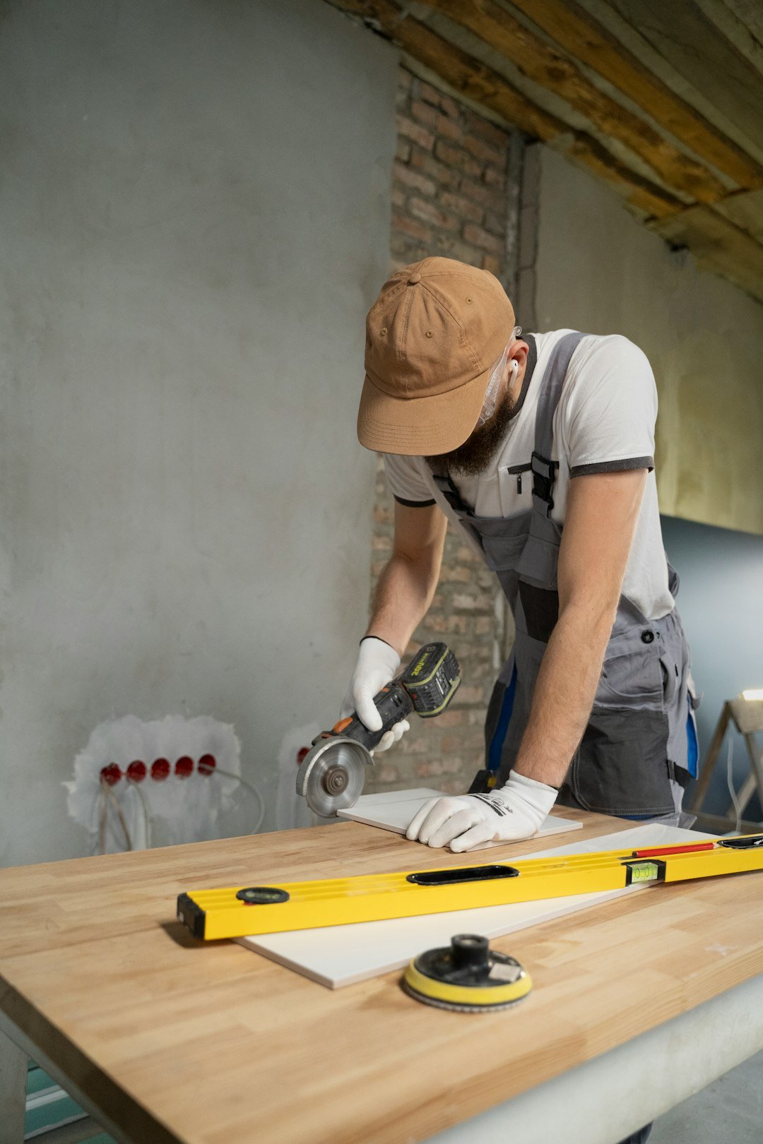 gallery-03 a-man-sanding-a-wooden-table-with-a-sander-6dnuvvieir8