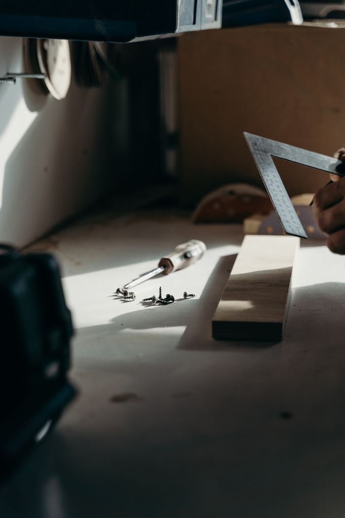 featured-images-01 A focused shot of carpentry tools on a workbench, capturing the essence of woodworking.